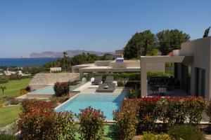 a view of a house with a swimming pool at Maravilla Luxury Living in Kos Town