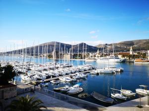 a bunch of boats docked in a harbor at YACHT marina Trogir, Heritage Bella Vistaa in Trogir