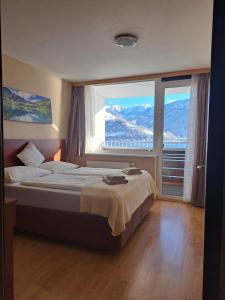 Postel nebo postele na pokoji v ubytování Appartement Alpensee