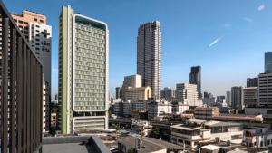 a view of a city with tall buildings at Pas Cher Hotel de Bangkok in Bangkok