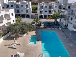 an aerial view of an apartment complex with a swimming pool at Oceania Bay Residence in Pyla