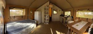 an interior view of a kitchen in a tiny house at Agriglamping EdenSardegna in Capoterra