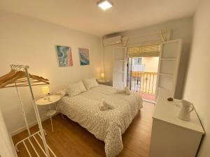 Postel nebo postele na pokoji v ubytování Sánchez Home, Pleno Centro