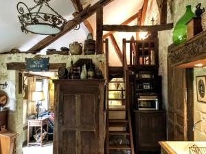 a room with an old wooden door and shelves at Maison confortable à Bréhémont avec jardin paisible in Bréhémont