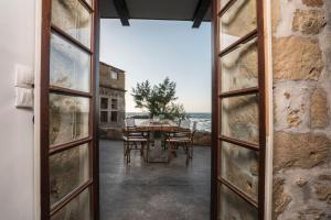 A balcony or terrace at kito- transformed house on the water's edge