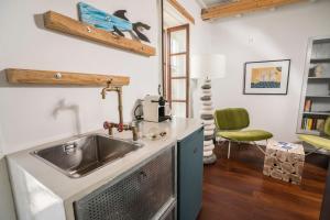 A kitchen or kitchenette at kito- transformed house on the water's edge