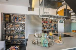 A kitchen or kitchenette at kito- transformed house on the water's edge
