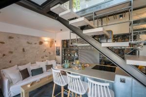 A seating area at kito- transformed house on the water's edge