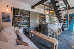 A seating area at kito- transformed house on the water's edge