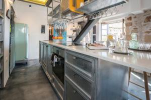 A kitchen or kitchenette at kito- transformed house on the water's edge