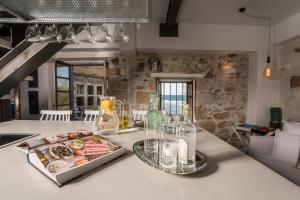 A seating area at kito- transformed house on the water's edge