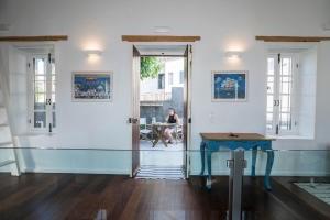 A seating area at kito- transformed house on the water's edge