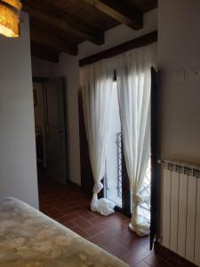 Postel nebo postele na pokoji v ubytování La Locanda n'gima all' ara