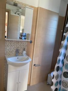 a bathroom with a sink and a shower at Villa Marialena III in Kato Gatzea +81 photos