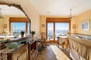 a dining room with a table and a mirror at Les Corts De Biosca in Castelltallat