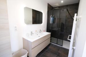 a bathroom with a sink and a shower at very beautiful villa with private pool in the luberon enjoying a magnificent view of the durance valley, located in puget – 10 people. in Puget