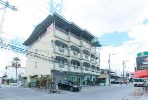 a black car parked in front of a building at RedDoorz @ Orsu Hotel Angeles Pampanga in Angeles