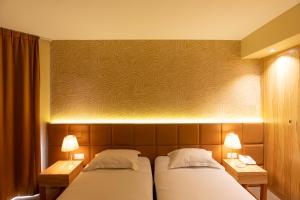 Letto o letti in una camera di Golden Tulip Avignon Le Paradou