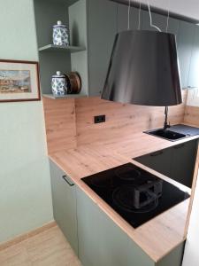Kuchyň nebo kuchyňský kout v ubytování EXCEPTIONNEL APPARTEMENT EN ESPAGNE