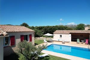 a villa with a swimming pool next to a house at pretty detached villa with private swimming pool, in Aureille, in the alpilles - 8 people in Aureille