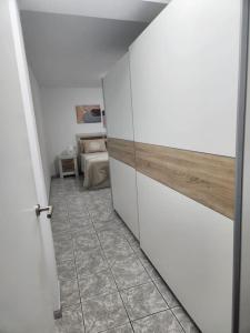 a room with a door leading to a bedroom at Fantastic Holiday Apartment in Arona