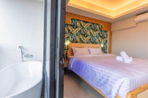 Postel nebo postele na pokoji v ubytování Mellow Poshtel - Kata Beach