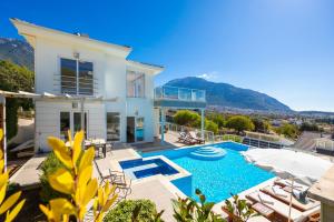 a villa with a swimming pool and a house at Residence Villa 1 in Oludeniz