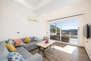 a living room with a couch and a table at Residence Villa 1 in Oludeniz