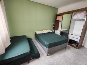 Ένα ή περισσότερα κρεβάτια σε δωμάτιο στο Férias com Piscina e Diversão, Reserve a Chácara Delira! +65 φωτογραφίες