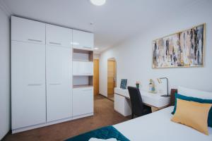Rúm í herbergi á Hotel Brcko Gas Doboj