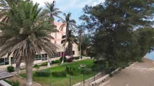 an aerial view of a building with palm trees at Le Cansado in Nouadhibou