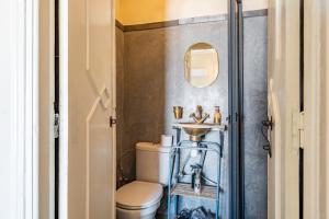 a bathroom with a toilet and a sink at Dar Noubti in Marrakech +47 photos