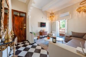 a living room with a couch and a table at Dar Noubti in Marrakech