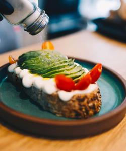 a piece of food with vegetables on a plate at Charcas Suites Palermo Soho in Buenos Aires +13 photos