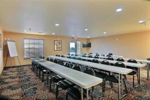 a conference room with tables and chairs in it at Cobblestone Hotel & Suites - McCook in McCook