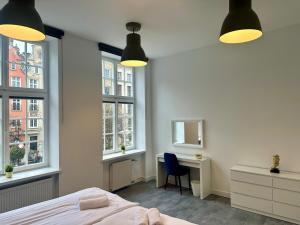 Posteľ alebo postele v izbe v ubytovaní Lunette Apartments - Długi Targ