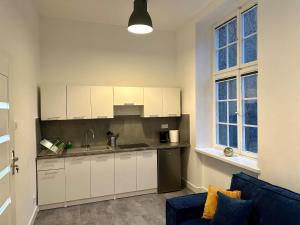 Kuchyňa alebo kuchynka v ubytovaní Lunette Apartments - Długi Targ
