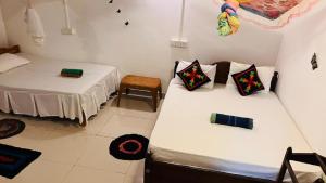 Letto o letti in una camera di Sigiri KP Family Home