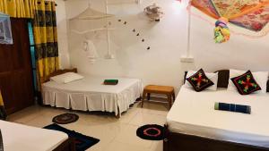 Letto o letti in una camera di Sigiri KP Family Home