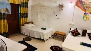Letto o letti in una camera di Sigiri KP Family Home