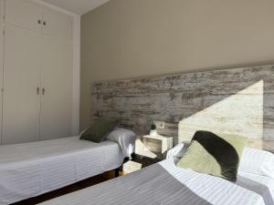 Ein Bett oder Betten in einem Zimmer der Unterkunft Agi Sant Jordi