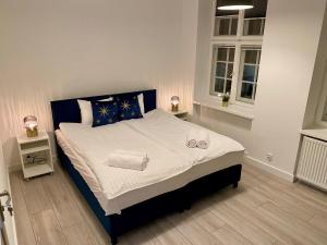 Posteľ alebo postele v izbe v ubytovaní Lunette Apartments - Długi Targ
