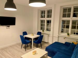 Televízia a/alebo spoločenská miestnosť v ubytovaní Lunette Apartments - Długi Targ