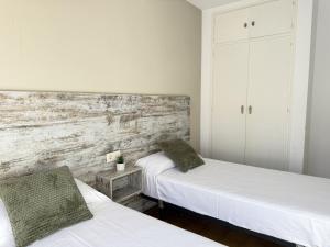Ein Bett oder Betten in einem Zimmer der Unterkunft Agi Sant Jordi