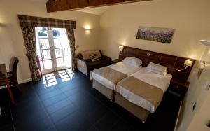 Letto o letti in una camera di Kings Croft Hotel