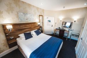 Letto o letti in una camera di Kings Croft Hotel
