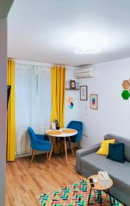 a living room with a couch and a table at Cozy Residence in Bucharest