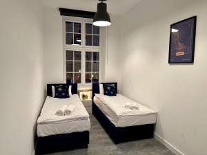 Posteľ alebo postele v izbe v ubytovaní Lunette Apartments - Długi Targ