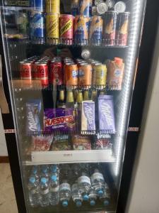 a refrigerator filled with lots of different types of drinks at El Escondite Perfecto in Benacazón