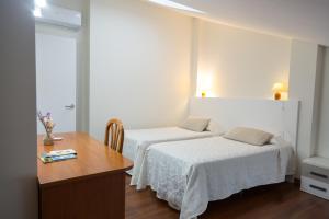 Posteľ alebo postele v izbe v ubytovaní Apartamentos Playa De Cóbreces